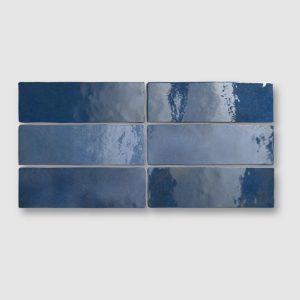 six Camden blue ceramic wall tiles, brick shaped
