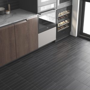 room showing Helsinki dark grey porcelain tiles, metro shaped.